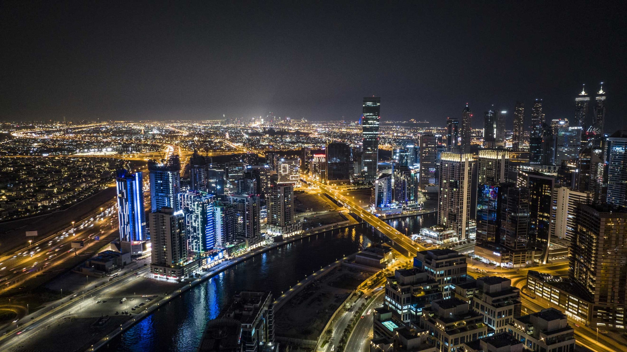 DVT canal city views night scaled - Immobilier Dubai