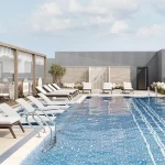 Stonehenge Residence par Segrex @ Jumeirah Village Circle 9 - Dubai Immobilier Terrasse de la piscine et salon de detente - Immobilier Dubai